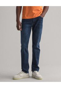 GANT - Granatowe jeansy Slim Fit. Kolor: niebieski #1