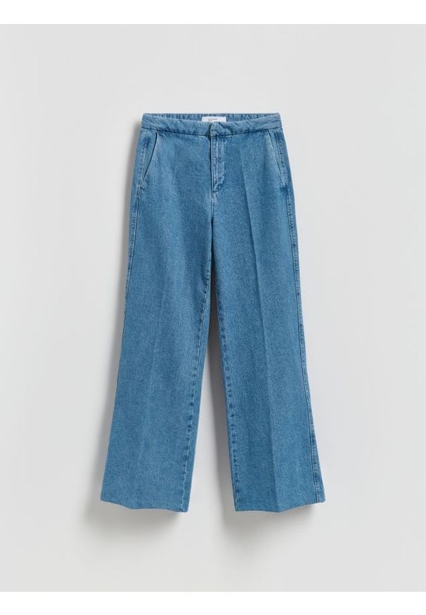 Reserved - Jeansy flare z kantem - niebieski. Kolor: niebieski