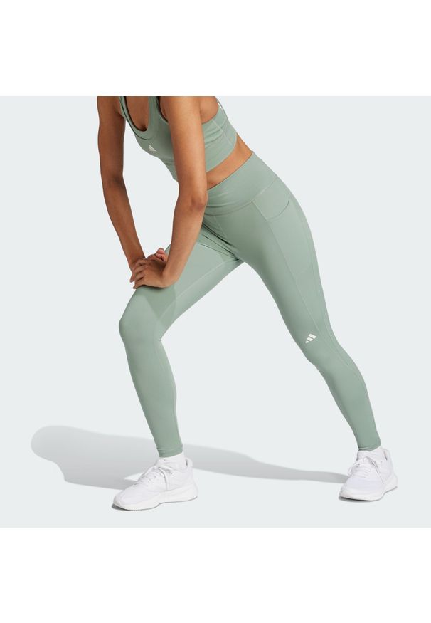 Adidas - Legginsy Own the Run 7/8. Kolor: zielony. Materiał: materiał. Wzór: gładki. Sport: bieganie