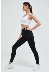 TOMMY HILFIGER - Tommy Hilfiger legginsy damskie kolor czarny gładkie. Kolor: czarny. Materiał: poliester, materiał, dzianina. Wzór: gładki #1