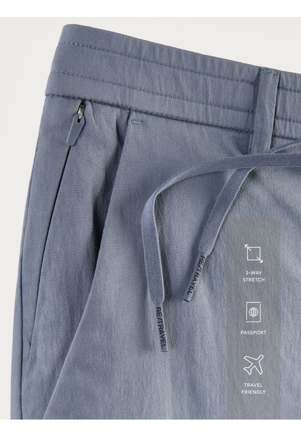 Reserved - Spodnie joggery - granatowy. Kolor: niebieski. Materiał: tkanina, bawełna