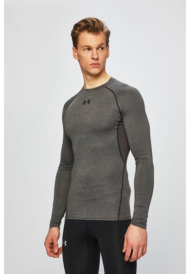 Under Armour - T-shirt. Kolor: szary. Materiał: poliester, materiał, dzianina, elastan. Długość rękawa: długi rękaw, raglanowy rękaw. Wzór: gładki