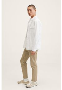 Mango Man spodnie męskie kolor beżowy dopasowane. Kolor: beżowy. Materiał: tkanina, włókno. Wzór: gładki #5