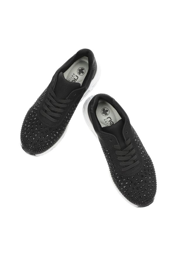 Czarne Sneakersy Rieker Stylowe Obuwie Damskie. Okazja: na co dzień. Kolor: czarny. Materiał: skóra ekologiczna. Wzór: aplikacja. Styl: elegancki