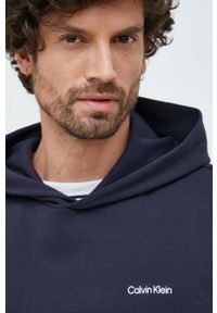 Calvin Klein bluza męska kolor granatowy z kapturem gładka. Typ kołnierza: kaptur. Kolor: niebieski. Materiał: dzianina. Wzór: gładki #3