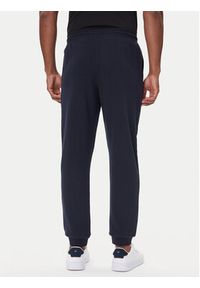 TOMMY HILFIGER - Tommy Hilfiger Spodnie dresowe UM0UM03664 Granatowy Regular Fit. Kolor: niebieski. Materiał: bawełna