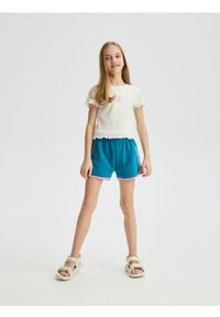 Reserved - Dresowe szorty z lampasem - morski. Kolor: morski. Materiał: dresówka #1