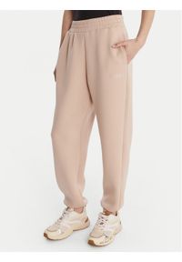 Guess Spodnie materiałowe 169841 Beżowy Slim Fit. Kolor: beżowy. Materiał: wiskoza #1