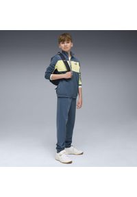 Puma - Młodzieżowy dres PUMA z poliestru z blokami kolorów PUMA. Okazja: na uczelnię. Kolor: niebieski. Materiał: poliester, dresówka. Wzór: nadruk. Styl: młodzieżowy #2