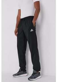 Adidas - adidas Spodnie męskie kolor czarny. Kolor: czarny. Materiał: materiał