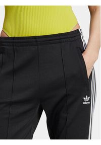 Adidas - adidas Spodnie dresowe adicolor SST IK6600 Czarny Slim Fit. Kolor: czarny. Materiał: bawełna #5