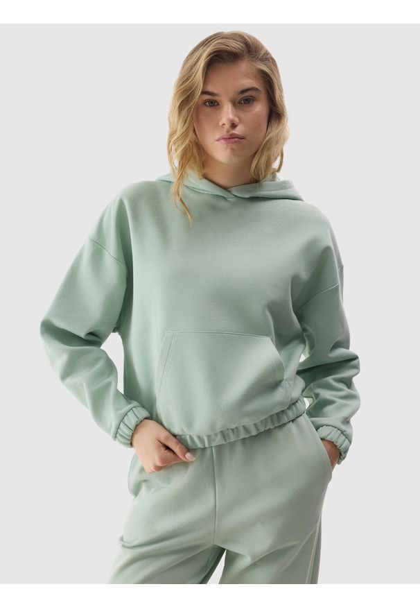 4f - 4F Bluza dresowa nierozpinana z kapturem damska - zielona XL. Okazja: na co dzień. Typ kołnierza: kaptur. Kolor: zielony. Materiał: dresówka, bawełna. Wzór: gładki, ze splotem. Styl: casual, sportowy