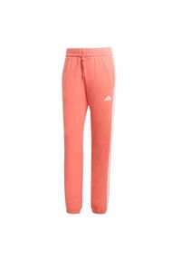 Adidas - Spodnie Essentials 3-Stripes French Terry Cuffed. Kolor: żółty, biały, pomarańczowy, wielokolorowy. Materiał: materiał
