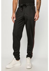 Trussardi Jeans - Spodnie. Kolor: czarny. Materiał: bawełna, dzianina, elastan. Wzór: aplikacja #1