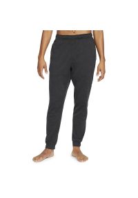 Spodnie dresowe Nike Yoga Dri-Fit CZ2208-010 - czarne. Kolor: czarny. Materiał: dresówka. Technologia: Dri-Fit (Nike)