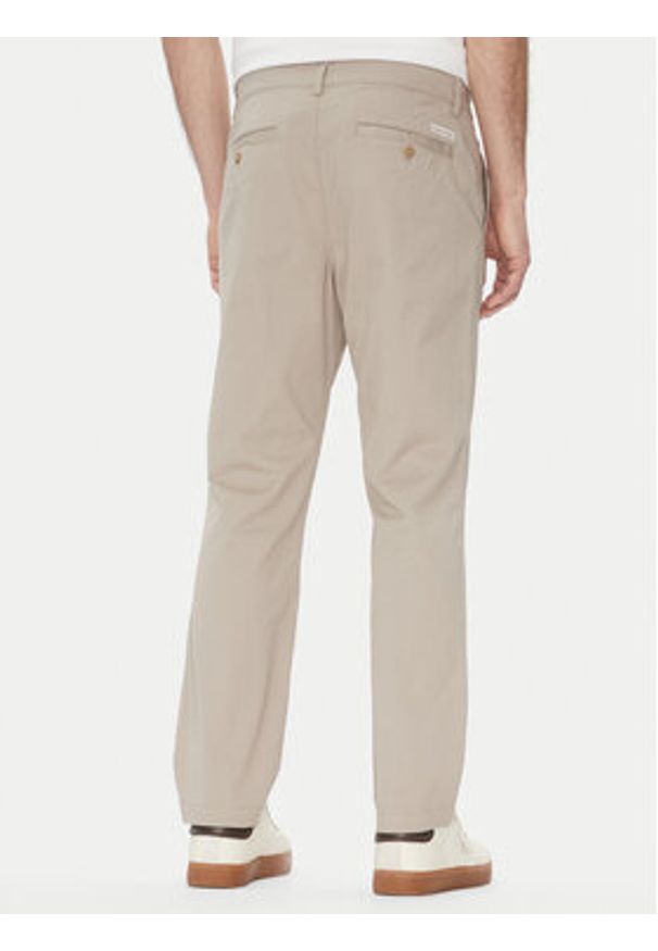 Calvin Klein Jeans Chinosy LV040EM628 Beżowy Slim Fit. Kolor: beżowy. Materiał: bawełna