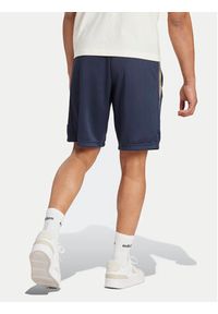 Adidas - adidas Szorty sportowe Tiro Wordmark IW5999 Granatowy Regular Fit. Kolor: niebieski. Materiał: syntetyk. Styl: sportowy