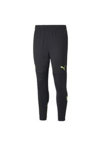 Puma - Trening joggingu Manchester City 2022/23. Kolor: wielokolorowy, żółty, czarny, zielony. Sport: bieganie, fitness #1