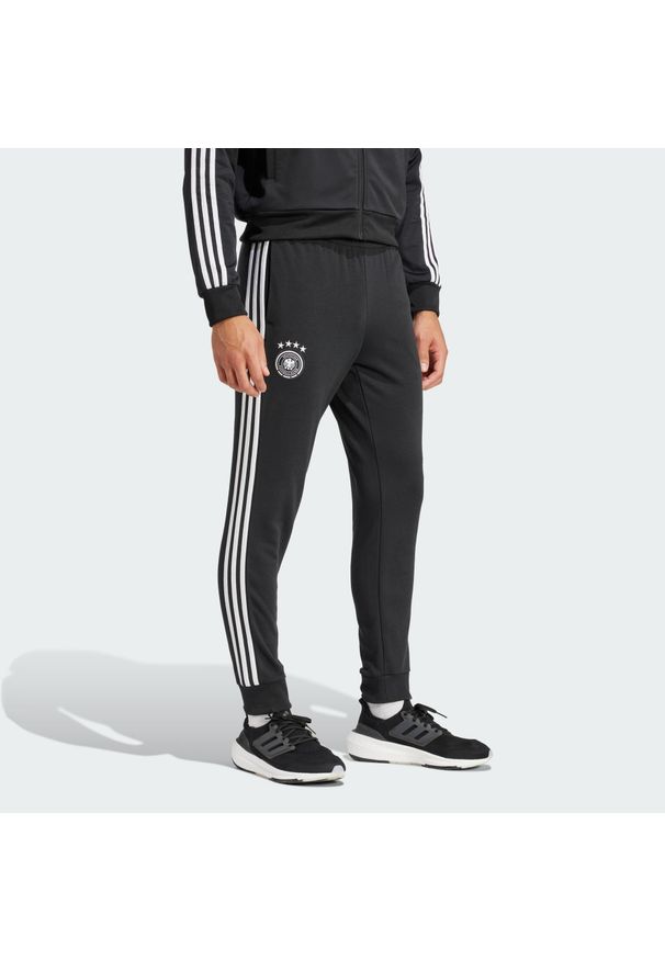 Adidas - Spodnie dresowe Germany DNA. Kolor: czarny. Materiał: dresówka
