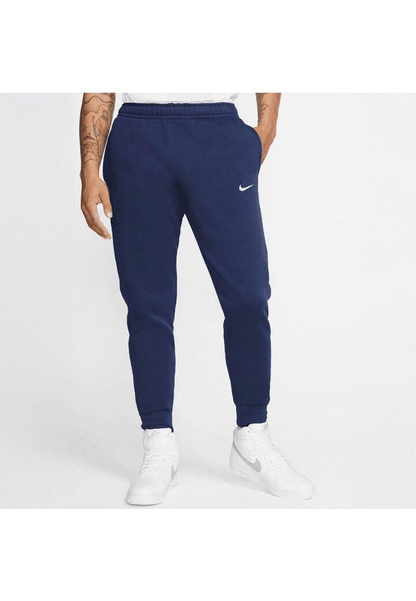 Spodnie Dresowe Męskie Nike Fleece Swoosh. Kolor: niebieski. Materiał: dresówka. Długość: długie