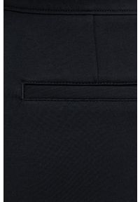 Spanx Legginsy modelujące damskie kolor czarny gładkie. Stan: podwyższony. Kolor: czarny. Materiał: materiał, dzianina. Wzór: gładki