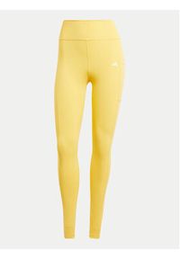 Adidas - adidas Legginsy Optime IT9111 Żółty Slim Fit. Kolor: żółty. Materiał: syntetyk