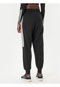 Adidas - adidas Spodnie dresowe Tiro 3-Stripes JL7488 Czarny Loose Fit. Kolor: czarny. Materiał: bawełna, syntetyk #4