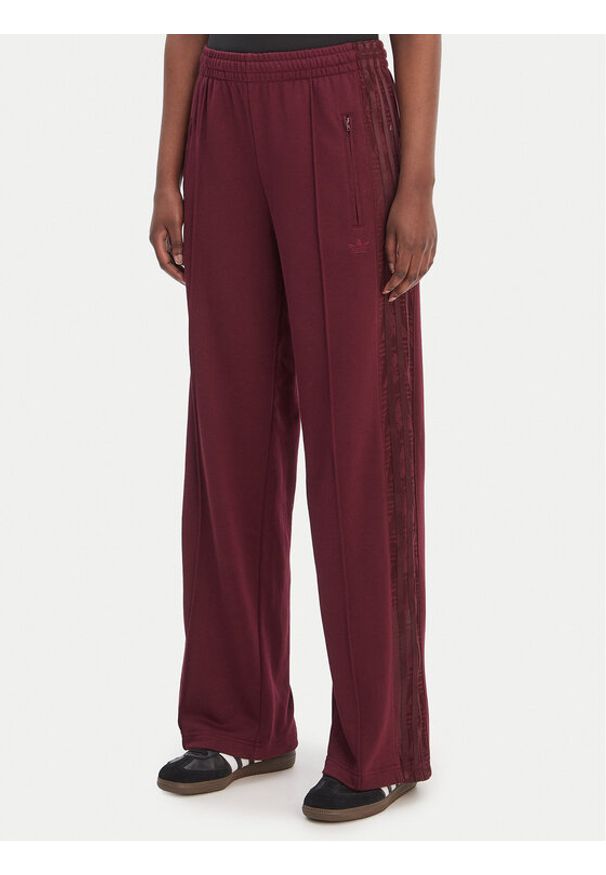 Adidas - adidas Spodnie dresowe Firebird Lace KC6445 Bordowy Loose Fit. Kolor: czerwony. Materiał: syntetyk