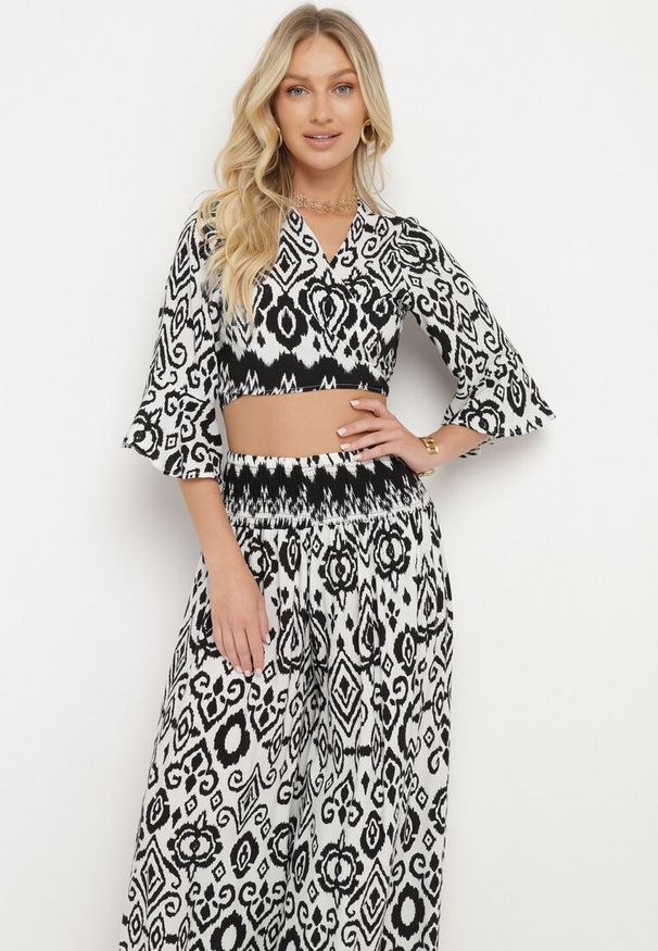 Born2be - Czarno-Biały Bawełniany Komplet Kopertowy Top z Wiązaniem Szerokie Spodnie z Gumką w Pasie Viknie. Kolor: czarny. Materiał: bawełna