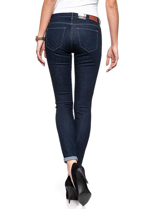 Wrangler - WRANGLER HIGH SKINNY COSY TOUCH W27HRL21N 112128115. Stan: podwyższony. Wzór: jednolity