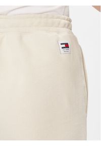 Tommy Jeans Spodnie dresowe Classics DW0DW17309 Beżowy Relaxed Fit. Kolor: beżowy. Materiał: bawełna