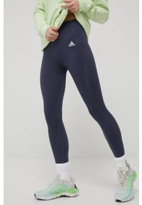 Adidas - adidas legginsy treningowe damskie kolor granatowy gładkie. Kolor: niebieski. Materiał: materiał, poliester, skóra. Wzór: gładki. Sport: fitness