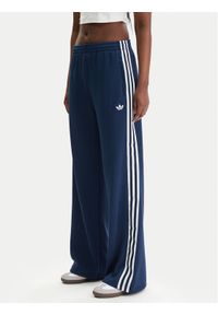 Adidas - adidas Spodnie dresowe adicolor Firebird JV7524 Granatowy Regular Fit. Kolor: niebieski. Materiał: syntetyk #1