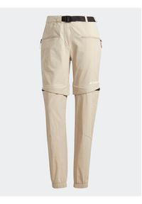 Adidas - adidas Spodnie dresowe Terrex Utilitas Hiking Zip-Off Tracksuit Bottoms HZ9046 Beżowy Regular Fit. Kolor: beżowy. Materiał: syntetyk #10