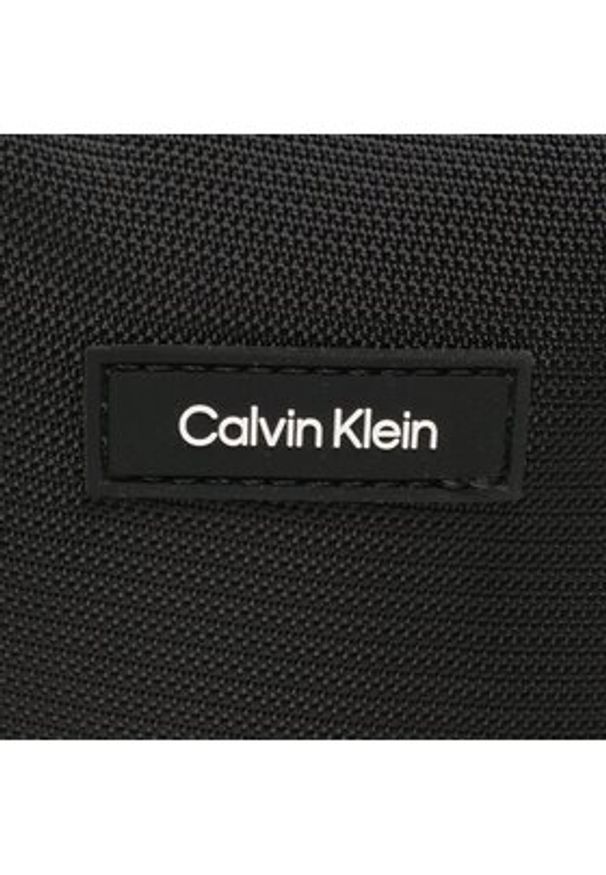 Calvin Klein Saszetka Ck Must T Reporter Xs K50K510570 Czarny. Kolor: czarny. Materiał: materiał