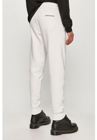 Calvin Klein Jeans - Spodnie. Kolor: biały. Materiał: bawełna, poliester, dzianina. Wzór: nadruk #3