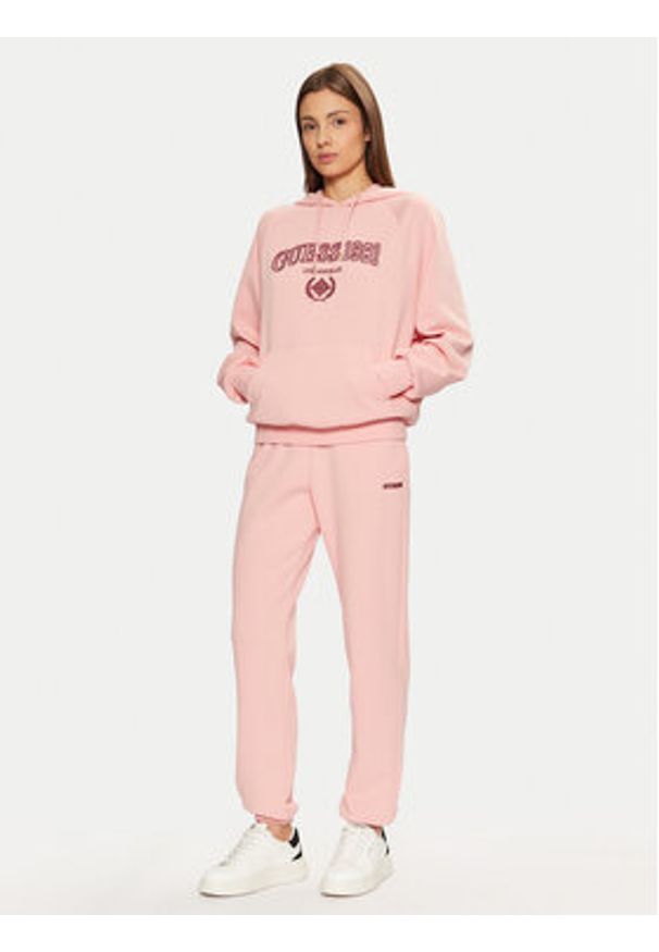 Guess Spodnie dresowe V5RB02 KCLD1 Różowy Regular Fit. Kolor: różowy. Materiał: bawełna