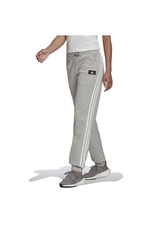 Adidas - Spodnie adidas Sportswear Future Icons 3-Stripes Regular Fit H57312 - szare. Kolor: szary. Materiał: materiał, bawełna, dresówka, poliester. Sport: turystyka piesza, fitness