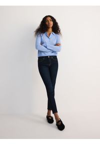 Reserved - Jeansy slim push up - granatowy. Kolor: niebieski #1