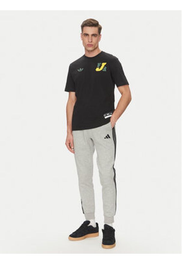 Adidas - adidas Spodnie dresowe Essentials 3-Stripes JE6318 Szary Regular Fit. Kolor: szary. Materiał: bawełna