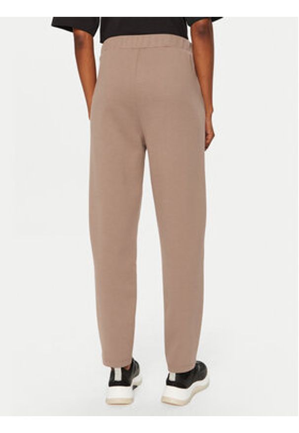 Calvin Klein Spodnie dresowe Satin K20K207945 Beżowy Slim Fit. Kolor: beżowy. Materiał: bawełna
