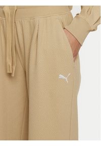 Puma Spodnie dresowe Her 676007 Beżowy Relaxed Fit. Kolor: beżowy. Materiał: bawełna, syntetyk #5