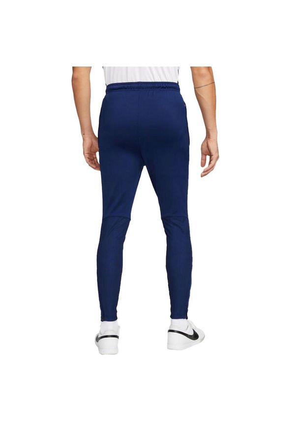 Nike - Męskie Spodnie Do Biegania Strike Winter Warrior ThermaFit. Kolor: niebieski. Materiał: dresówka