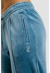 Juicy Couture - JUICY COUTURE Niebieskie damskie spodnie dresowe Tina Trackpants, Rozmiar S. Kolor: niebieski. Materiał: dresówka