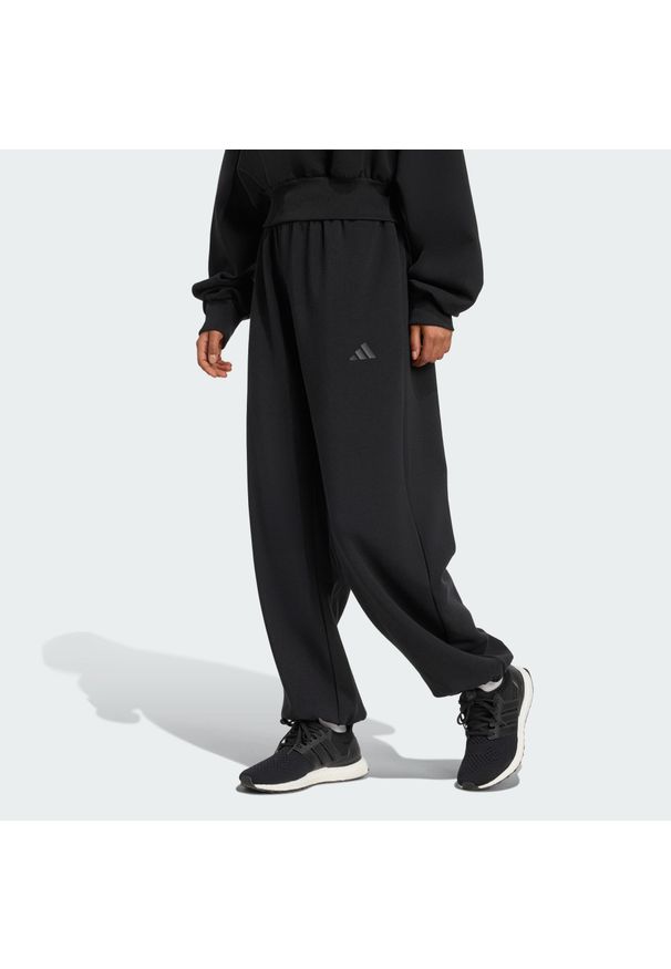 Adidas - Spodnie Soft Lux Loose. Kolor: czarny. Sport: fitness
