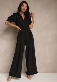 Renee - Czarny Kombinezon Taliowany Ozdobiony Klamrą Filenala. Kolor: czarny. Wzór: aplikacja. Styl: elegancki