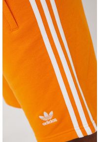 adidas Originals szorty bawełniane Adicolor męskie kolor pomarańczowy. Kolor: pomarańczowy. Materiał: bawełna