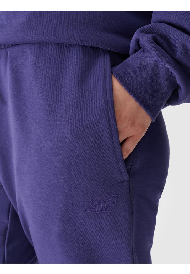 4f - 4F Spodnie dresowe joggery uniseks - granatowe XL. Kolor: niebieski. Materiał: dresówka. Wzór: gładki, ze splotem