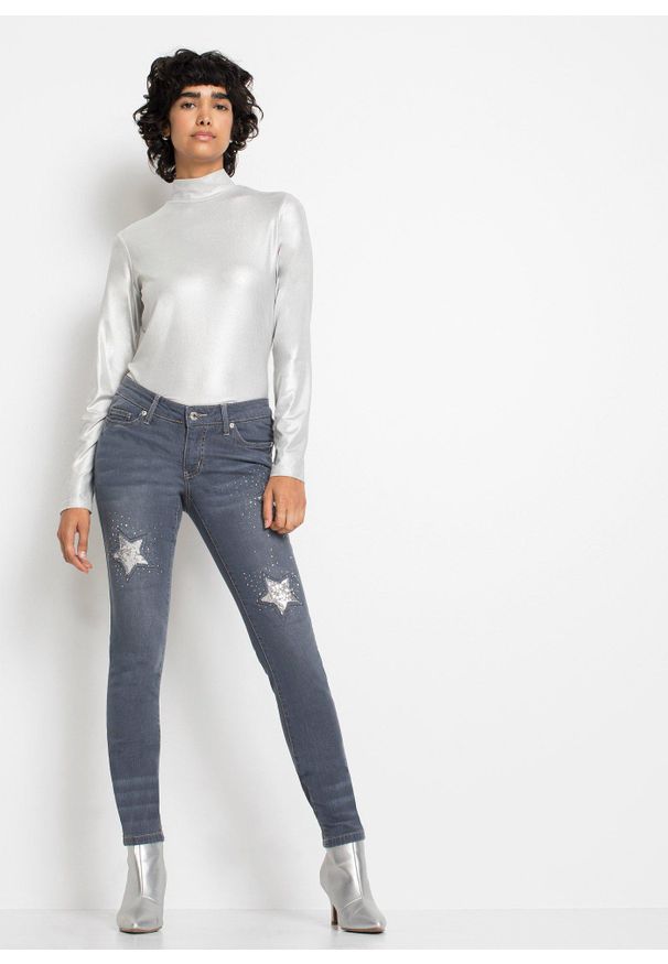 bonprix - Jeansy skinny z niskim stanem, z nadrukiem gwiazdek. Stan: obniżony. Kolor: niebieski. Wzór: nadruk