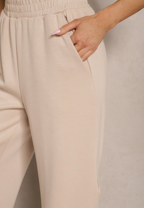 Renee - Beżowe Spodnie o Szerokim Kroju High Waist z Gumką w Pasie Belobira. Okazja: na co dzień. Stan: podwyższony. Kolor: beżowy. Długość: długie. Styl: wizytowy, elegancki, casual